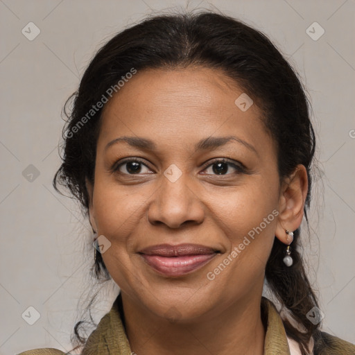 Joyful black adult female with medium  brown hair and brown eyes