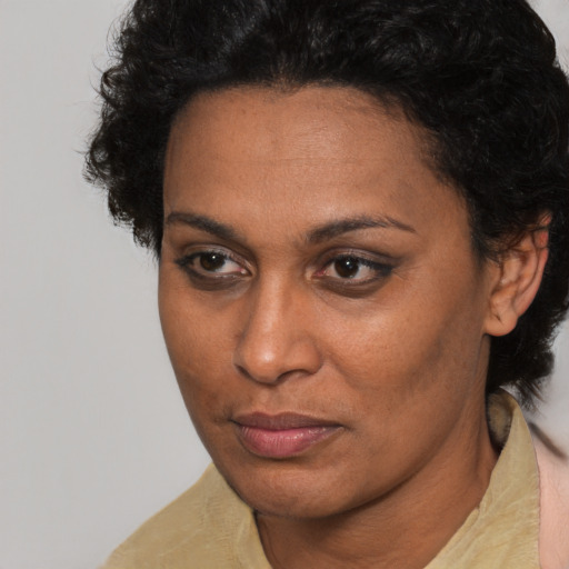 Neutral black adult female with short  brown hair and brown eyes