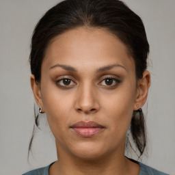 Joyful black young-adult female with medium  brown hair and brown eyes