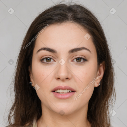 Joyful white young-adult female with long  brown hair and brown eyes