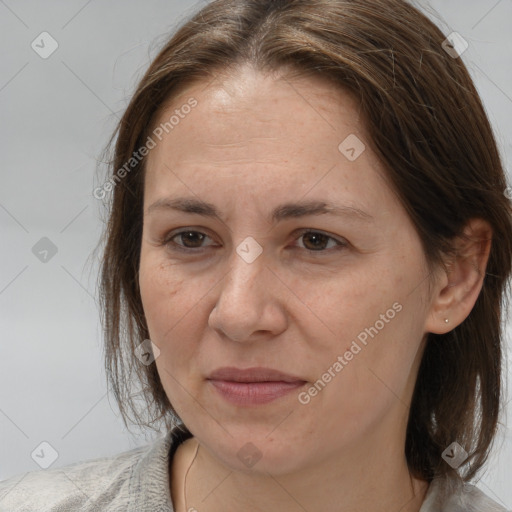 Joyful white adult female with medium  brown hair and brown eyes