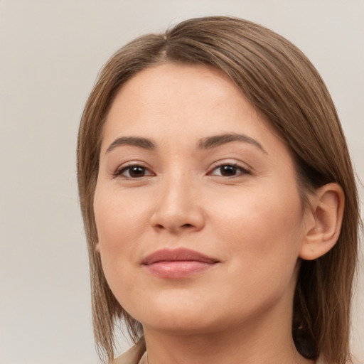 Joyful white young-adult female with medium  brown hair and brown eyes