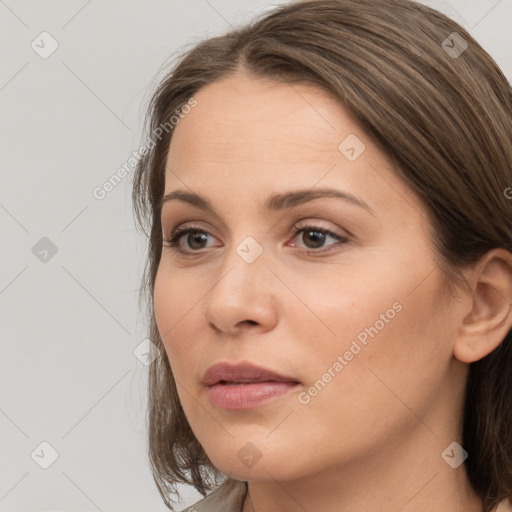 Neutral white young-adult female with long  brown hair and brown eyes