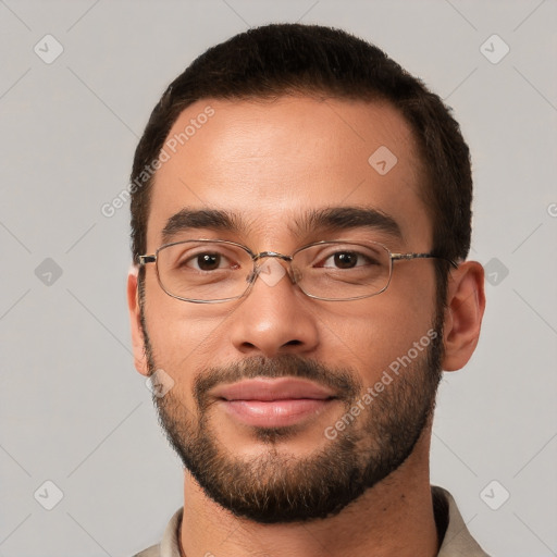 Joyful white young-adult male with short  brown hair and brown eyes