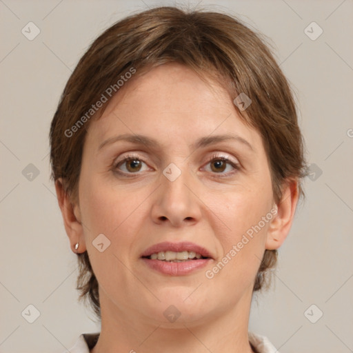 Joyful white young-adult female with medium  brown hair and green eyes