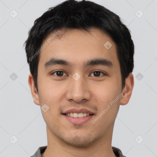 Joyful asian young-adult male with short  black hair and brown eyes