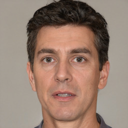 Neutral white adult male with short  brown hair and brown eyes