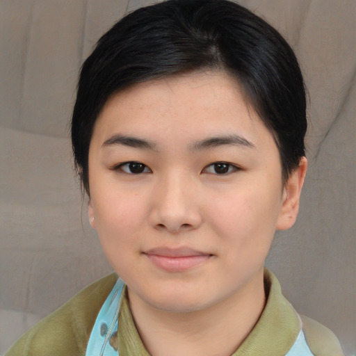 Joyful asian young-adult female with medium  black hair and brown eyes