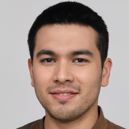 Joyful asian young-adult male with short  black hair and brown eyes