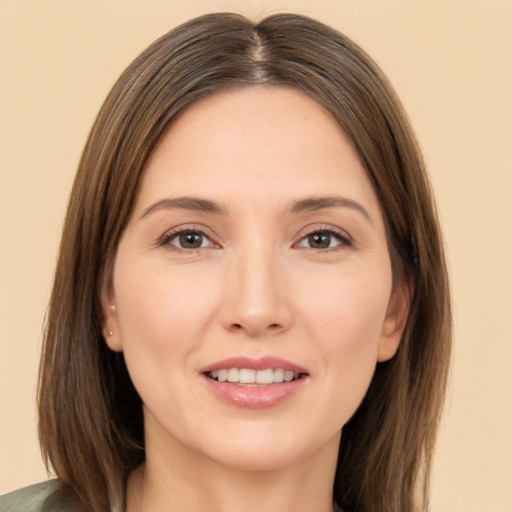 Joyful white young-adult female with long  brown hair and brown eyes