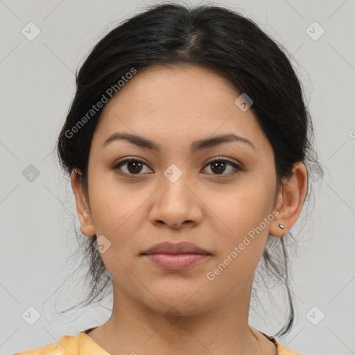 Joyful latino young-adult female with medium  brown hair and brown eyes