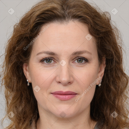 Joyful white adult female with long  brown hair and brown eyes