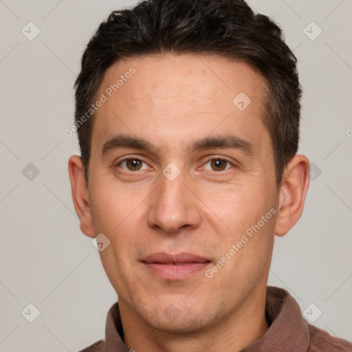 Joyful white adult male with short  brown hair and brown eyes