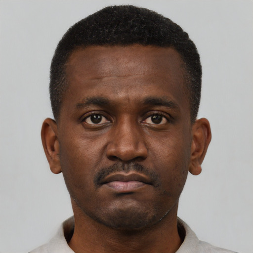 Neutral black young-adult male with short  brown hair and brown eyes