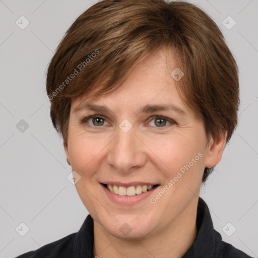 Joyful white adult female with short  brown hair and brown eyes