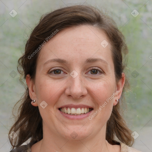 Joyful white adult female with medium  brown hair and grey eyes