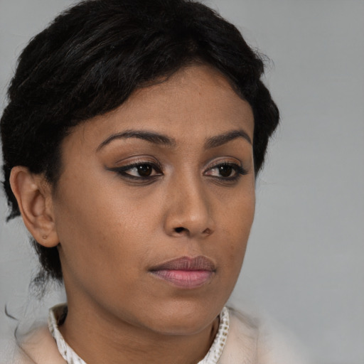Neutral black young-adult female with short  brown hair and brown eyes