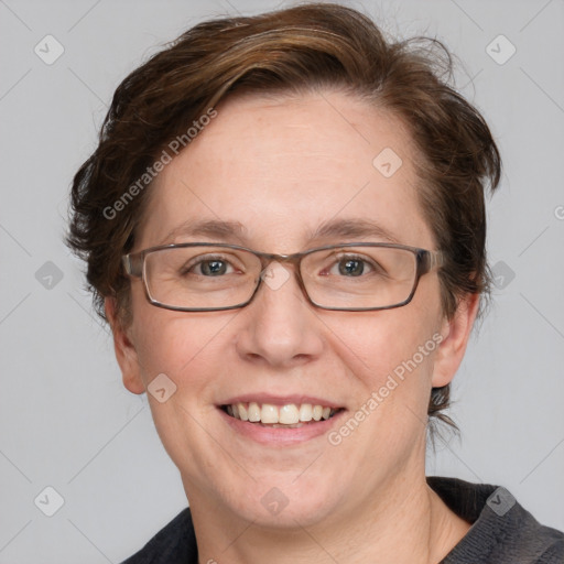 Joyful white adult female with medium  brown hair and blue eyes