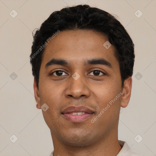 Joyful latino young-adult male with short  black hair and brown eyes