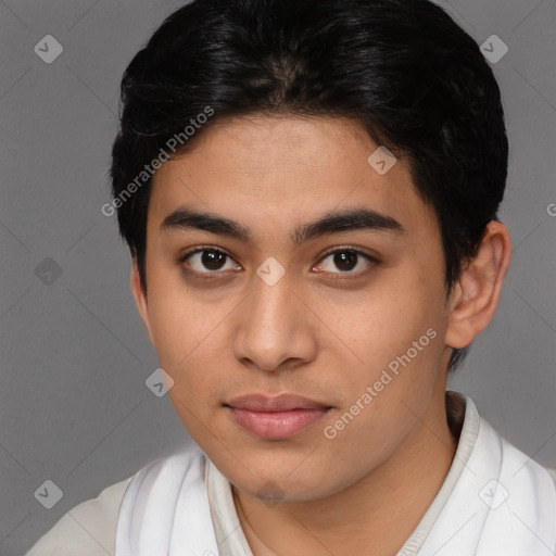 Joyful latino young-adult male with short  brown hair and brown eyes