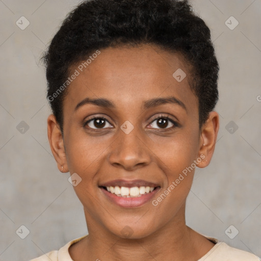 Joyful black young-adult female with short  brown hair and brown eyes