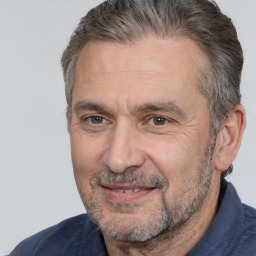 Joyful white middle-aged male with short  brown hair and brown eyes