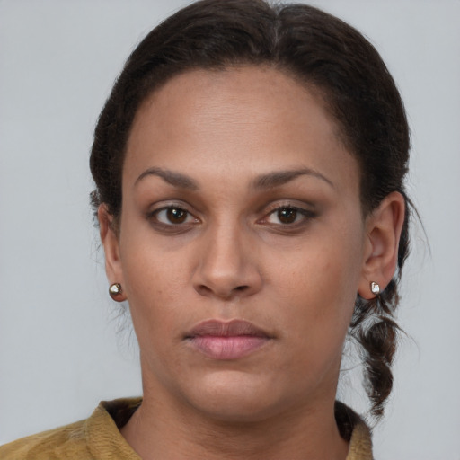 Neutral black young-adult female with medium  brown hair and brown eyes