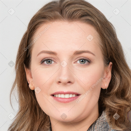 Joyful white young-adult female with long  brown hair and blue eyes