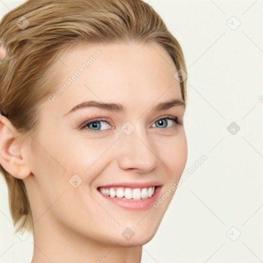 Joyful white young-adult female with medium  brown hair and green eyes