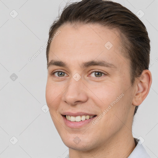 Joyful white young-adult female with short  brown hair and brown eyes