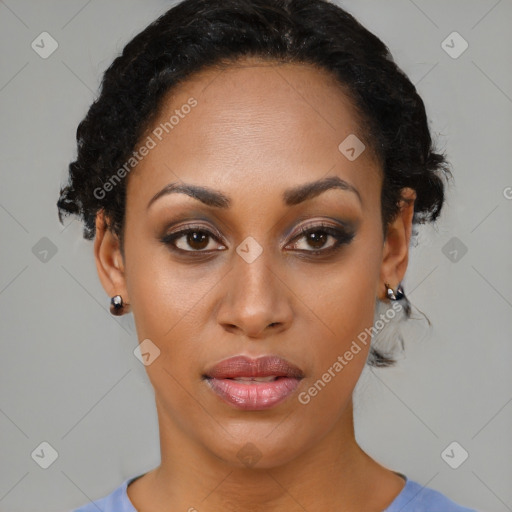 Joyful black young-adult female with short  black hair and brown eyes
