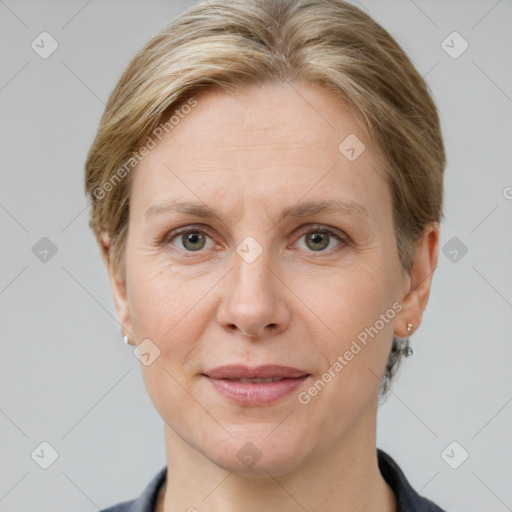 Joyful white adult female with short  brown hair and grey eyes