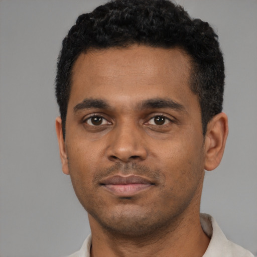 Neutral black young-adult male with short  black hair and brown eyes