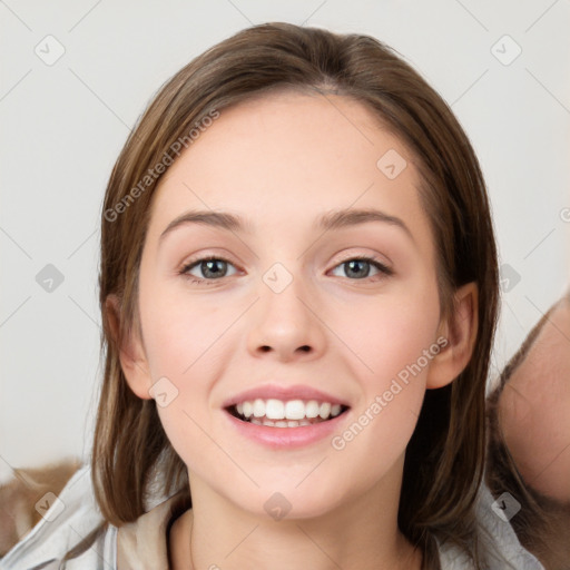 Joyful white young-adult female with long  brown hair and grey eyes