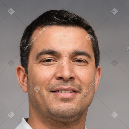 Joyful white adult male with short  brown hair and brown eyes