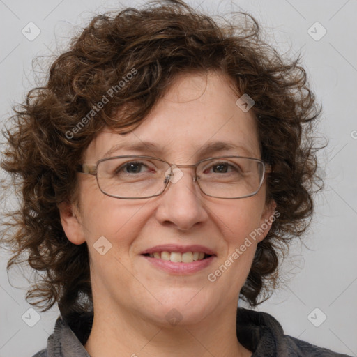 Joyful white adult female with medium  brown hair and blue eyes