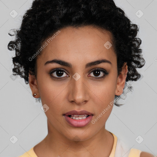 Joyful latino young-adult female with short  black hair and brown eyes