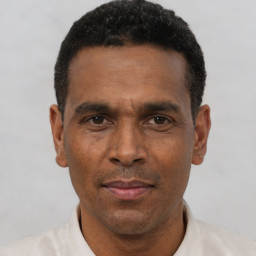Neutral latino adult male with short  black hair and brown eyes