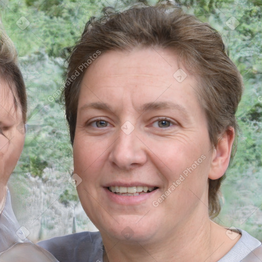 Joyful white adult female with short  brown hair and brown eyes