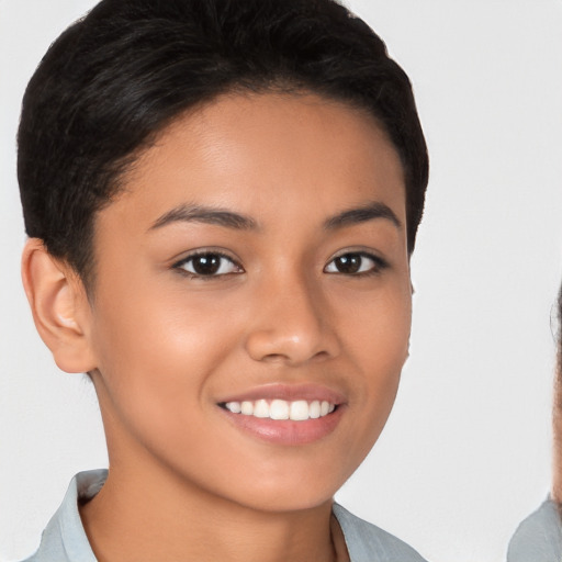 Joyful latino young-adult female with short  brown hair and brown eyes