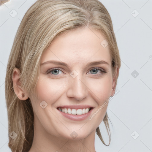 Joyful white young-adult female with medium  brown hair and blue eyes