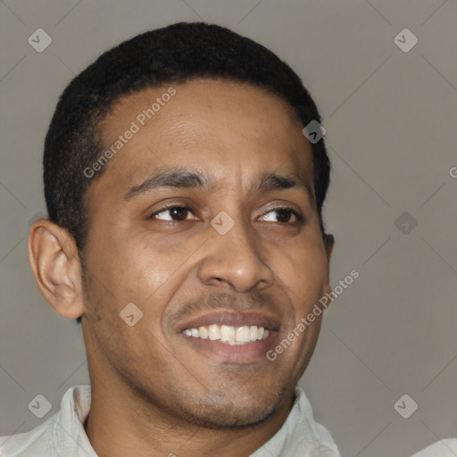 Joyful black adult male with short  black hair and brown eyes