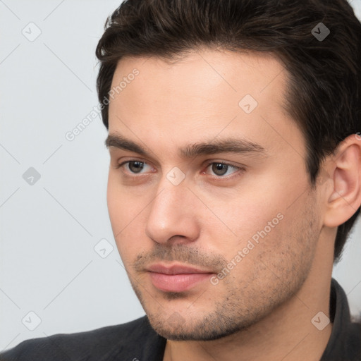 Neutral white young-adult male with short  brown hair and brown eyes