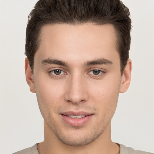 Joyful white young-adult male with short  brown hair and brown eyes