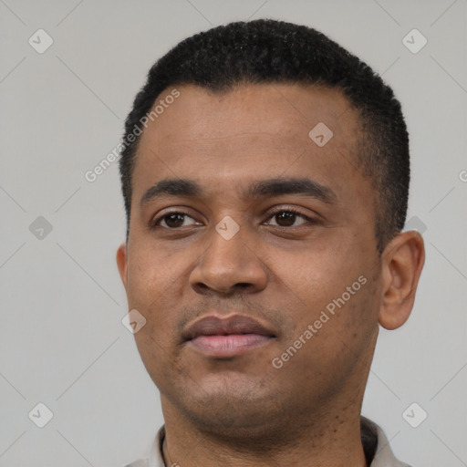 Neutral latino young-adult male with short  black hair and brown eyes