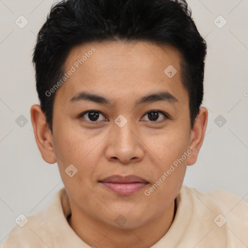 Joyful latino young-adult male with short  brown hair and brown eyes