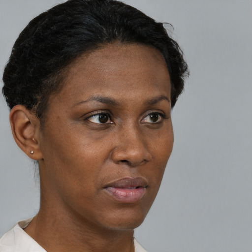 Neutral black adult female with short  brown hair and brown eyes