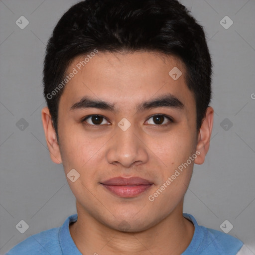Joyful asian young-adult male with short  brown hair and brown eyes