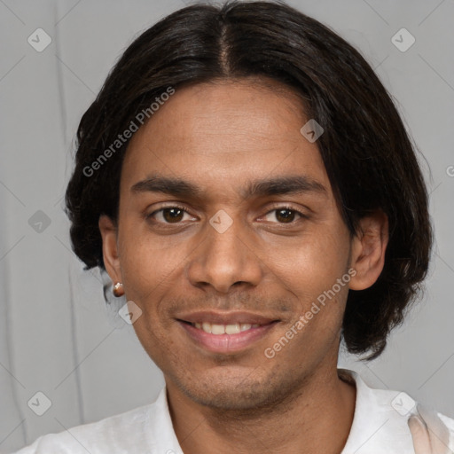 Joyful white adult male with short  black hair and brown eyes