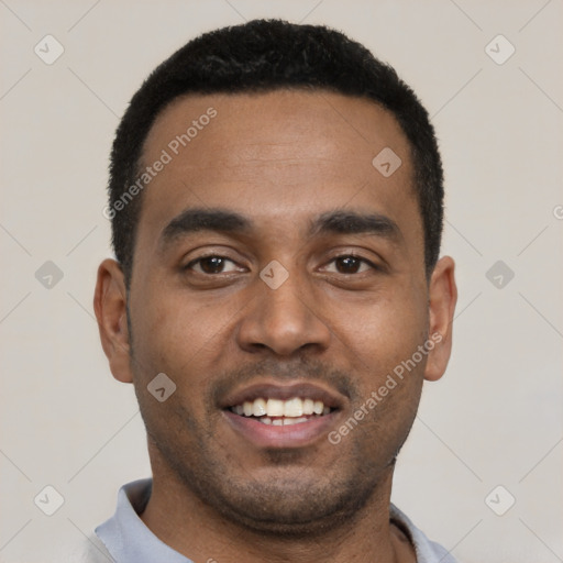 Joyful black young-adult male with short  black hair and brown eyes